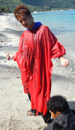 beach boy in poncho